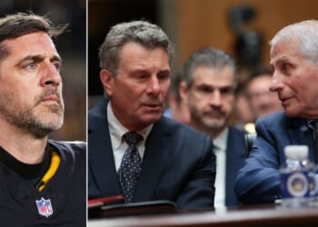 Former NIH Director Anthony Fauci, right, consults with his attorney David Schertler as he testifies before a Senate Homeland Security and Governmental Affairs Committee hearing July 29 in Washington, D.C. Pittsburg Steelers quarterback Aaron Rodgers, left, was unrepentant for his harsh criticism of Fauci Monday on live TV.
