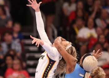Sophie Cunningham of the Indiana Fever is fouled by DiJonai Carrington of the Chicago Sky during the first half at United Center on Aug. 8, 2026, in Chicago, Illinois.
