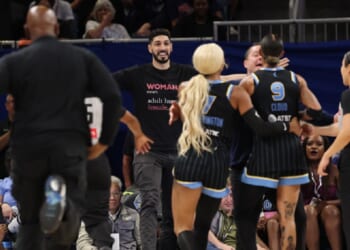 Former NBA player Enes Kanter Freedom has a courtside clash with the WNBA's Natasha Cloud during a Chicago Sky-Indiana Fever game in Chicago on Sunday. Kanter Freedom was ejected from Chicago's Wintrust Arena.