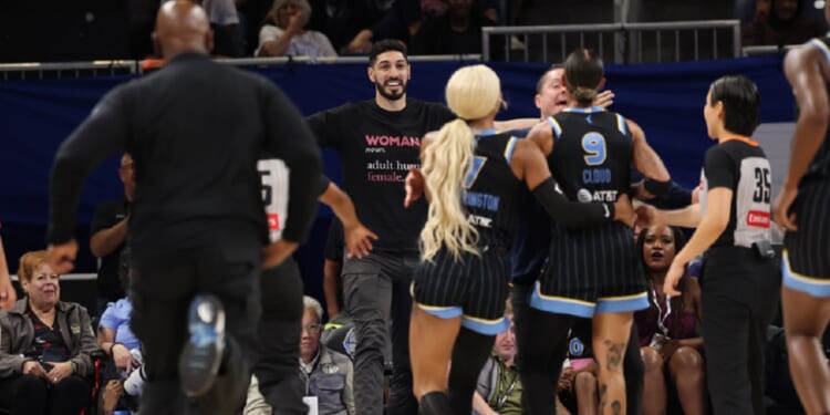 Former NBA player Enes Kanter Freedom has a courtside clash with the WNBA's Natasha Cloud during a Chicago Sky-Indiana Fever game in Chicago on Sunday. Kanter Freedom was ejected from Chicago's Wintrust Arena.