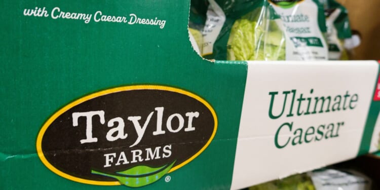 Packages of Taylor Farms Ultimate Caesar Salad Kit are displayed for sale in the refrigerated produce department at a Costco Wholesale warehouse on July 29, 2026, in Arlington, Virginia.