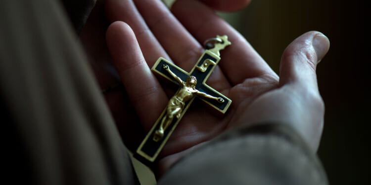 Sister Michaela holding the crucifix on her rosary at the Klarissenkloster convent of St. Clara in Bautzen, Germany, 22 January 2016. Katrin Damm grew up in a non-religious home but chose to be baptised in 2006, after finding God. She finally entered the order of the Klarissen (Poor Clares) as Sister Michaela in 2009. The Poor Clares follow the way of life of Clare of Assisi, a contemporary and follower of St. Francis of Assisi. PHOTO: ARNO BURGI