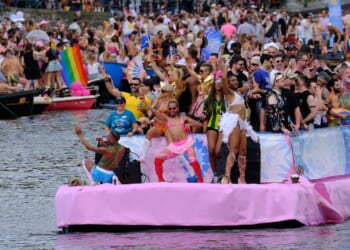 Hundreds of thousands line Amsterdam canals for the annual Pride boat parade
