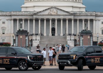 Immigration and Customs Enforcement vehicles are pictured in an August 2025 file photo outside the U.S. Capitol.