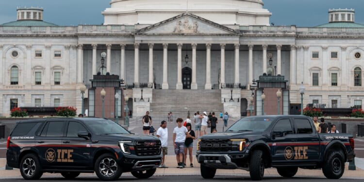 Immigration and Customs Enforcement vehicles are pictured in an August 2025 file photo outside the U.S. Capitol.