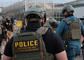 Immigration and Customs Enforcement agents block protesters as cars exit Delaney Hall, which is being used as an Immigration and Customs Enforcement detention center, on May 27, 2026, in Newark, New Jersey.