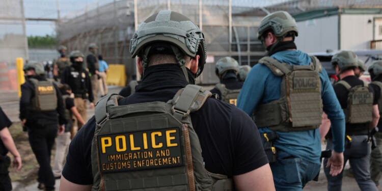 Immigration and Customs Enforcement agents block protesters as cars exit Delaney Hall, which is being used as an Immigration and Customs Enforcement detention center, on May 27, 2026, in Newark, New Jersey.