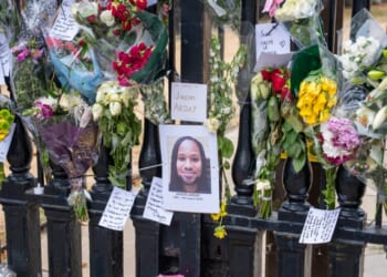 Flowers and cards placed by students and staff outside The Senate House on Aug. 17, 2026, in Cambridge, England.