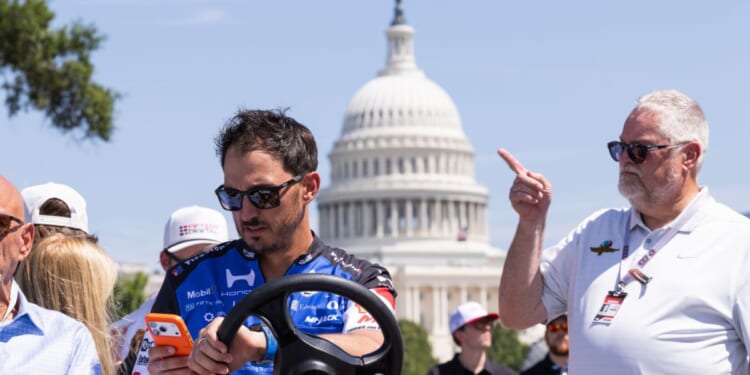 Graham Rahal rides a cart on the Freedom 250 Grand Prix track along the National Mall on Aug. 21, 2026, in Washington, D.C.