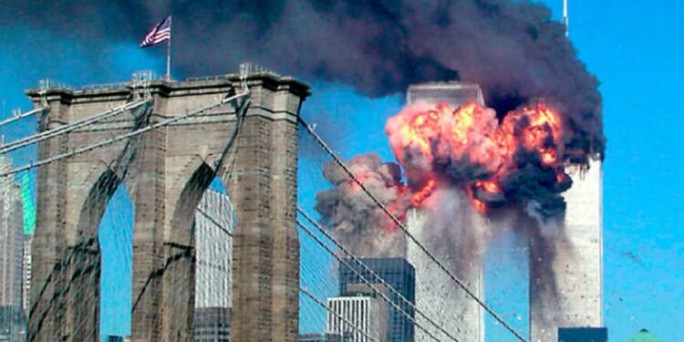 The Twin Towers of the World Trade Center burn before collapsing in the terror attacks of 9/11.