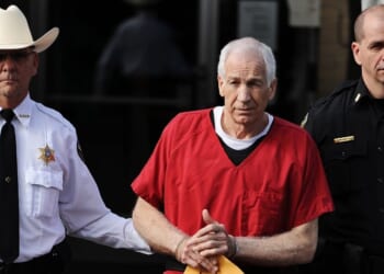 Former Penn State assistant football coach Jerry Sandusky leaves the Centre County Courthouse after being sentenced in his child sex abuse case on Oct. 9, 2012, in Bellefonte, Pennsylvania.
