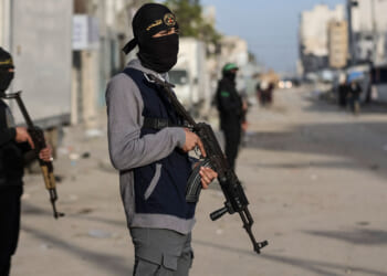 Members of Palestinian Hamas's Ezzedine Al-Qassam Brigades and Islamic Jihad's Quds Brigades are deployed at intersections for Eid al-Fitr prayers.