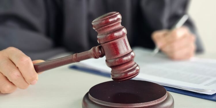 A judge presides over a courtroom.