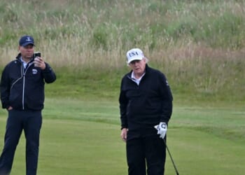 President Donald Trump looks on as he plays golf at the Trump Turnberry Golf Courses, in Turnberry on the southwest coast of Scotland on July 27, 2025, during the third day of his visit to the country, since his second tenure as President began.