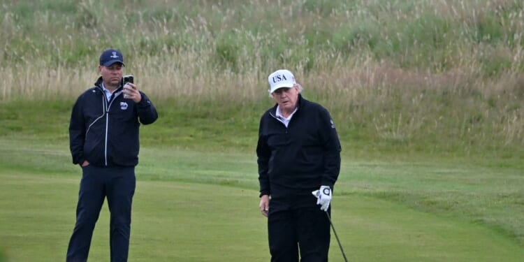 President Donald Trump looks on as he plays golf at the Trump Turnberry Golf Courses, in Turnberry on the southwest coast of Scotland on July 27, 2025, during the third day of his visit to the country, since his second tenure as President began.