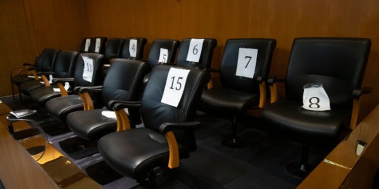 An empty jury box is pictured in a courtroom with numbered seats inside on February 6, 2024 in Pontiac, Michigan.