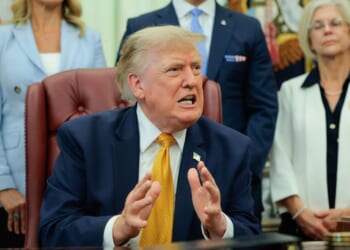 President Donald Trump speaks to the media after signing an executive order establishing the President's Military Spouse Commission in the Oval Office at the White House on Aug. 3, 2026, in Washington, D.C.