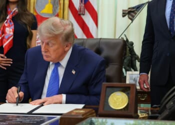 President Donald Trump signs an executive order in the Oval Office on August 10, 2026 in Washington, D.C.
