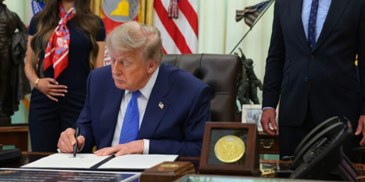 President Donald Trump signs an executive order in the Oval Office on August 10, 2026 in Washington, D.C.