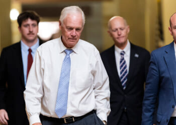 U.S. Sen. Ron Johnson (R-WI), Sen. Rick Scott (R-FL), and Sen. Mike Lee (R-UT) walk towards Senate Chambers in the U.S. Capitol.