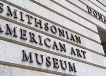 The lettering of the Smithsonian American Art Museum is viewed on the side of a building during the day on July 26, 2026 in Washington, D.C.