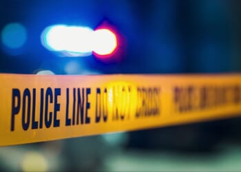 A close-up shot of police tape at a crime scene.