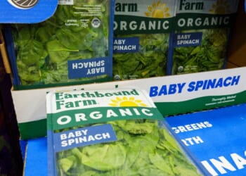 Packages of Earthbound Farm organic baby spinach are displayed for sale in the refrigerated produce department at a Costco Wholesale warehouse on July 29, 2026, in Arlington, Virginia.