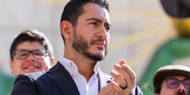 Michigan Democratic Senate primary winner Abdul El-Sayed claps during a news conference Wednesday after his victory over Rep. Haley Stevens.