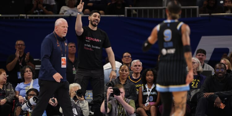 Former NBA player Enes Kanter Freedom gets in a dispute on Sunday with the the Chicago Sky's Natasha Cloud during a Sky-Indiana Fever WNBA game at Chicago's Wintrust Arena.