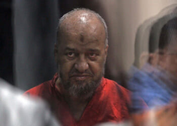 Senior Egyptian Muslim Brotherhood member Mohamed el-Beltagi is seen behind bars during a verdict and sentencing session of a retrial for him and other Brotherhood members.