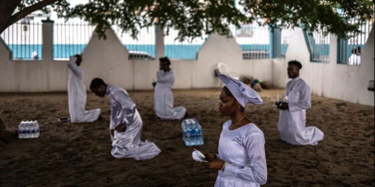 Christian worshippers pray at the Celestial Church of Christ international headquarters in Lagos, Nigeria on July 12, 2026.