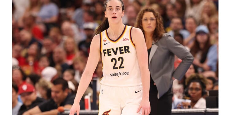 Caitlin Clark #22 of the Indiana Fever is seen with with head coach Stephanie White Saturday during the first half of the game against the Chicago Sky.