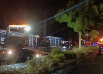 Police officials investigate the scene where a man drove a car into a group of people in the north-western French city of Caen late Wednesday.