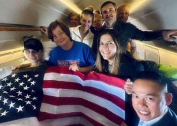 Secretary of State Marco Rubio shared a photo of Robert Gilman, left, on his flight home.