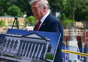 President Donald Trump speaks to journalists outside the construction site of the new White House ballroom in Washington on May 19, 2026.