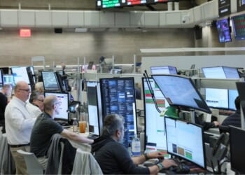 Traders work on the floor of the New York Stock Exchange during morning trading on March 10, 2026, in New York City.