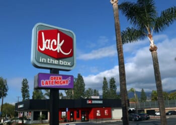A storefront for a Jack in the Box Restaurant as seen from sidewalk along Historical Route 66 in Azusa, California.