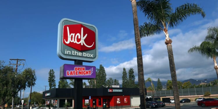 A storefront for a Jack in the Box Restaurant as seen from sidewalk along Historical Route 66 in Azusa, California.