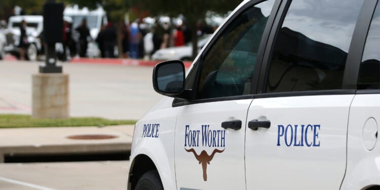 A Fort Worth Police car is parked outside the funeral service for Atatiana Jefferson on Oct. 24, 2019, at Concord Church in Dallas, Texas.