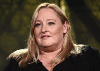 Former SPLC CFO Heidi Beirich, founder of the Global Project Against Hate and Extremism, got arrested Wednesday. Pictured: Beirich, a woman with long blonde hair and a black top sits in front of a blurred background, looking slightly to the side with a neutral expression.