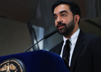 New York City Mayor Zohran Mamdani speaks at a food distribution center on July 27, 2026 in the Brooklyn borough of New York City. Mamdani announced that the five upcoming city-owned grocery stores will offer a 30 percent discount on produce, meat, bread, and milk when they begin to open next year. The discount on essential items will potentially save shoppers an estimated $90 a month, or roughly $1,000 a year, as prices for food and other items continue to rise throughout the country. The mayor has pledged one community grocery store for each borough. (Photo by Spencer Platt/Getty Images)