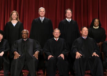 The justices of the United States Supreme Court pose for a photograph in Washington on Oct. 7, 2022.