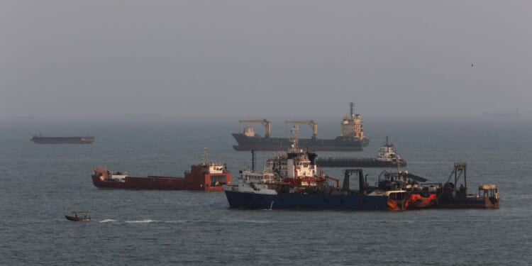 Ships are anchored in the Strait of Hormuz on Aug. 10, 2026, off the coast of Bandar Abbas, Iran.