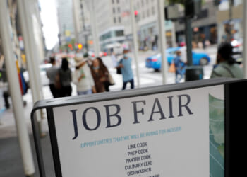 Signage for a job fair is seen on 5th Avenue after the release of the jobs report in Manhattan, New York City, Sept. 3, 2021. REUTERS/Andrew Kelly