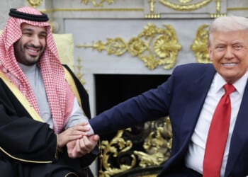 Donald Trump (R) shaking the hand of Crown Prince and Prime Minister Mohammed bin Salman of Saudi Arabia in the Oval Office