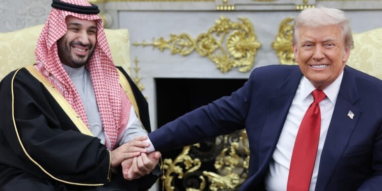 Donald Trump (R) shaking the hand of Crown Prince and Prime Minister Mohammed bin Salman of Saudi Arabia in the Oval Office