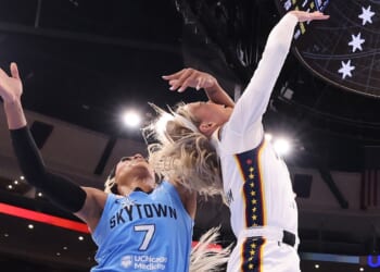 Sophie Cunningham of the Indiana Fever is fouled by DiJonai Carrington of the Chicago Sky during the first half at United Center on Aug. 8, 2026, in Chicago, Illinois.
