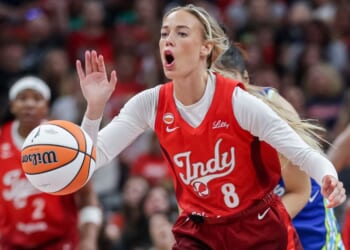 Sophie Cunningham #8 of the Indiana Fever reaches for the ball during the first half Friday against the Dallas Wings at Gainbridge Fieldhouse in Indianapolis, Indiana.