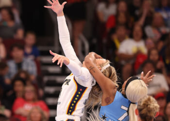 Sophie Cunningham #8 of the Indiana Fever is fouled by DiJonai Carrington #7 of the Chicago Sky during the first half at United Center on August 08, 2026 in Chicago, Illinois. (Michael Reaves/Getty Images)