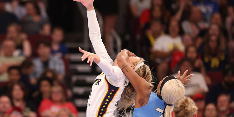 Sophie Cunningham #8 of the Indiana Fever is fouled by DiJonai Carrington #7 of the Chicago Sky during the first half at United Center on August 08, 2026 in Chicago, Illinois. (Michael Reaves/Getty Images)